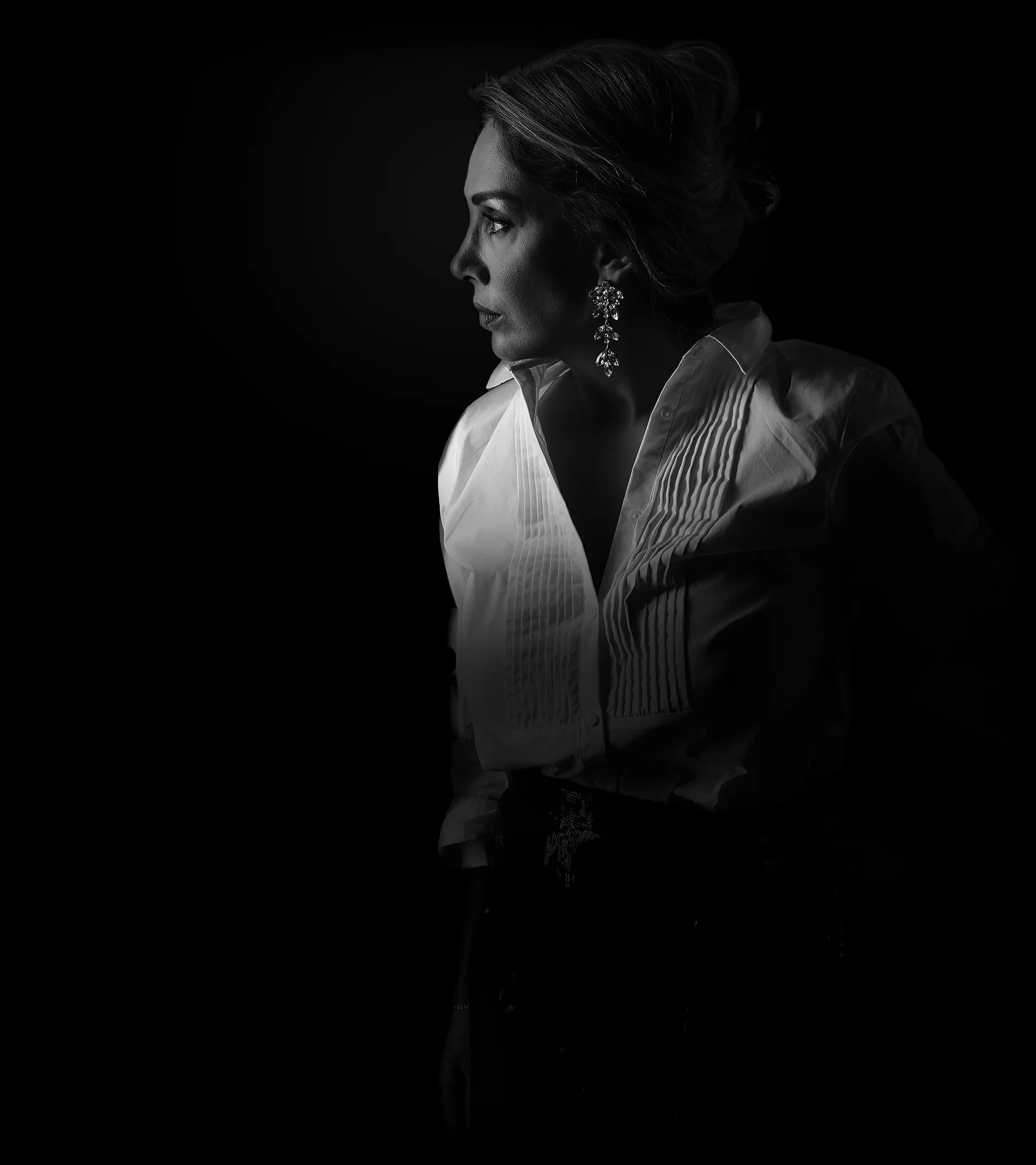 Paria Ghorashi at a window, in black and white