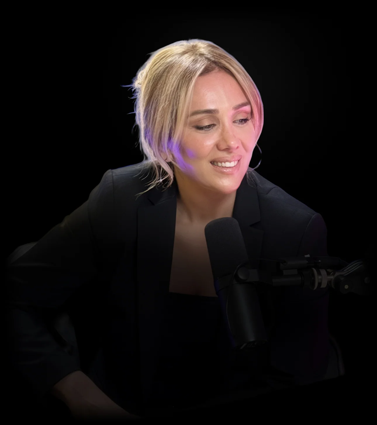 Paria Ghorashi at the microphone in a podcast studio